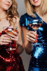 Kaboompics - Close-Up of Two Women Raising Wine Glasses
