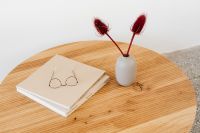 Kaboompics - Red Dried Flower Arrangement with Books and Eyeglasses on a Wooden Table