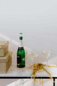 Kaboompics - Champagne Bottle and Glasses on Festive Console