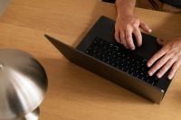 Kaboompics - Hands Typing on a Laptop with a Stylus Nearby