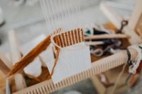 Kaboompics - White Warp Threads on a Wooden Weaving Loom