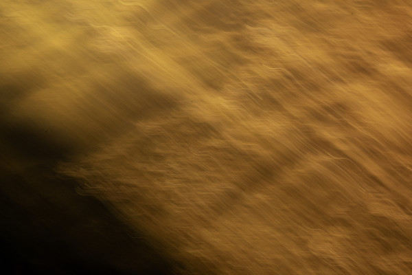 Soft Gold Motion Blur with a Dark Center, Wide Abstract Background ...