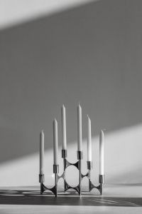 Kaboompics - Chrome Candelabra on Wooden Table with Sunlight