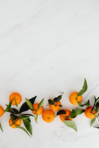 Kaboompics - Mandarins Along the Lower Edge of White Marble for Citrus Recipe Text Overlay