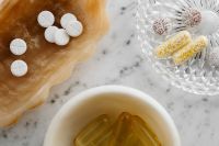 Kaboompics - White Tablets, Capsules and Supplement Bowls on Marble
