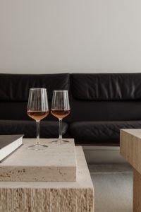 Kaboompics - Black Sofa, Travertine Tables and Open Book