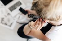 Kaboompics - Woman listening to music with earphones