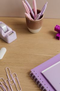 Kaboompics - Pen Cup and Purple Notebook on Desk