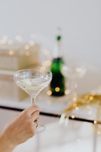 Kaboompics - Champagne Glass Toast With Bottle in Soft Focus