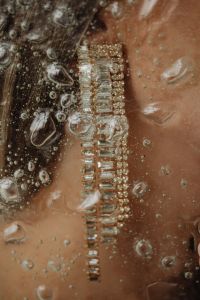 Kaboompics - Gold Bracelet Detail on Skin with Water Droplets