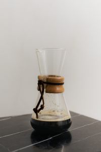 Kaboompics - Glass Chemex Coffee Brewer on Black Slate Table