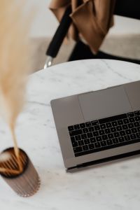 Kaboompics - MacBook Pro 15 laptop and iPhone 11 Pro on a marble table