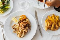 Kaboompics - Fried Seafood Platter with Lemon, Fries and Table Setting