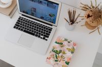Kaboompics - Close-Up Laptop, Pencil Cup and Floral Notebook on White Desk