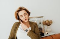 Kaboompics - Woman Relaxing on a Leather Sofa at Home Wearing a Smartwatch