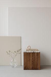 Kaboompics - Minimalist Interior with Walnut Pedestal, Art Books and Neutral Canvas Copy Space