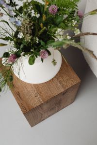 Kaboompics - Wildflower Arrangement in White Vase on Wooden Pedestal