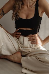 Kaboompics - Neutral Fashion Portrait with Black Crop Top and White Pants
