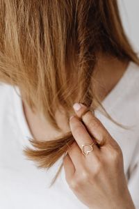 Kaboompics - Hand Holding a Section of Hair While Checking the Ends