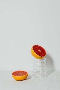 Kaboompics - Grapefruit on a Glass Pedestal with Copy Space for Product Styling