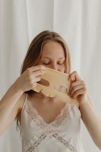 Kaboompics - Woman Preparing a Sheet Mask for Her Sensitive Skin Routine