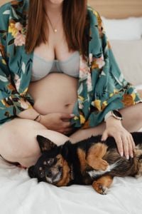 Kaboompics - Pregnant Woman in Floral Robe with a Small Dog