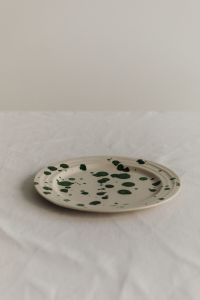Kaboompics - Green Splatter Ceramic Plate with Generous Neutral Copy Space