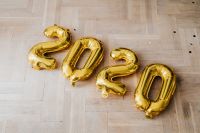 Kaboompics - Gold 2020 Balloons Lying On Herringbone Wood Floor