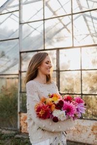 Kaboompics - Side Profile Of Woman Holding Dahlia Bouquet