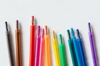 Kaboompics - Upright Colored Crayons on a Clean White Surface, Minimal School Supplies Background
