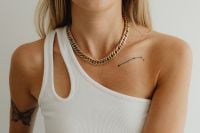 Kaboompics - Woman in a White Asymmetric Tank Wearing a Chunky Gold Chain Necklace, Fashion Portrait