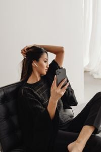 Black Suit Businesswoman Lifestyle with Smartphone, Laptop and Work