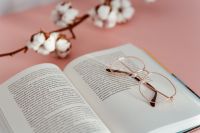 Kaboompics - Open Book and Rose Gold Glasses Styled with Cotton Branches