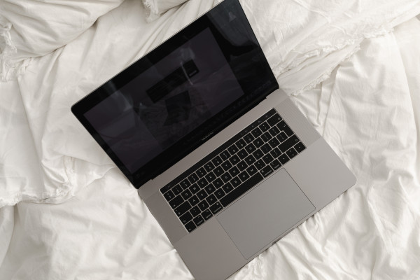 Working with a laptop in bed - white cotton bedding. Ideal for bed and ...