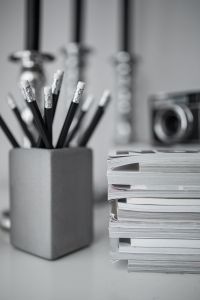 Pencils, magazines and an old lightbulb