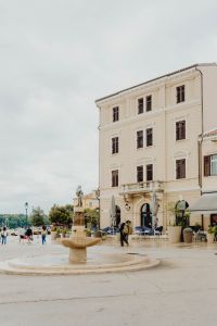 Kaboompics - Historic Rovinj Square with Fountain, Café Terrace and Waterfront Buildings