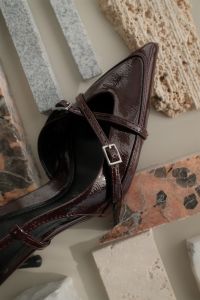 Kaboompics - Cherry Burgundy Heel with Stone and Texture Flat Lay