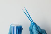 Kaboompics - Blue Dental Microbrushes Beside Storage Container