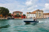 Kaboompics - Motorboat Crossing the Venetian Lagoon before Murano’s Colorful Waterfront