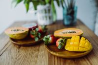 Kaboompics - Tropical Fruit Platters with Mango, Papaya and Dragon Fruit on a Wooden Table for Healthy Recipe Styling