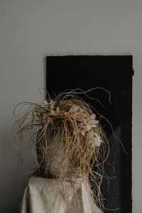 Kaboompics - Dried Grass and Flowers in a Textured Sculptural Vase