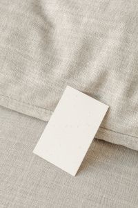 Kaboompics - Portrait Brand Card Mockup Propped on Beige Upholstery