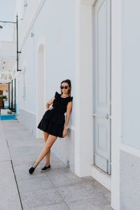 Kaboompics - Street Style Portrait by a White Mediterranean Facade with Open Sky