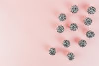Kaboompics - Glittering Silver Ornaments in a Soft Pink Holiday Flat Lay
