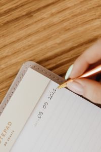 Kaboompics - Minimal Notebook Writing Scene on Wood Background