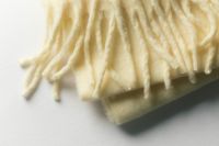 Kaboompics - Soft Cream Scarf Fringe in Natural Light for Winter Aesthetic