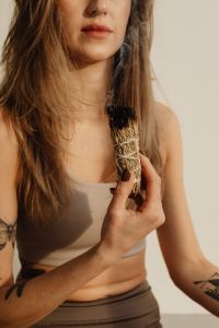 Kaboompics - Woman Holding Smoldering Sage Near Her Face