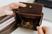 Kaboompics - Open Brown Leather Wallet Filled with Coins