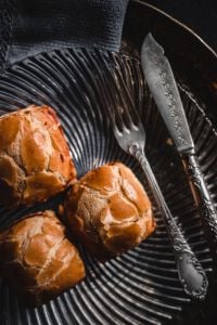 Kaboompics - Three Sweet Buns with Ornate Fork and Knife