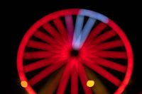 Kaboompics - Red Ferris Wheel with a Blue Spoke Highlight at the Top